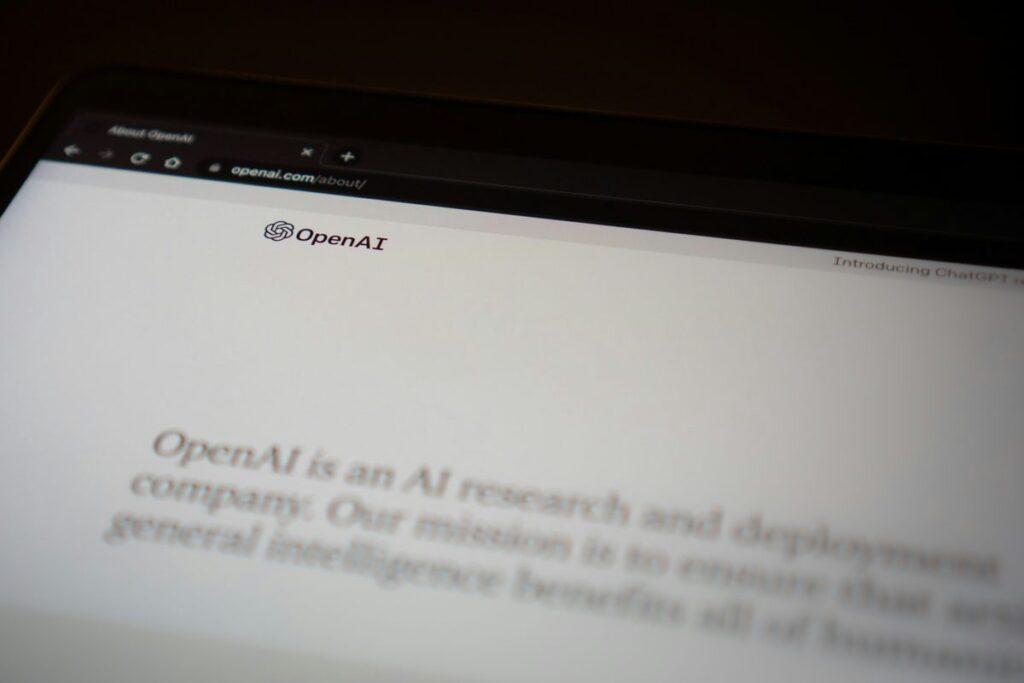Laptop showing OpenAI homepage illustrating generative engine optimization for service based businesses in AI search